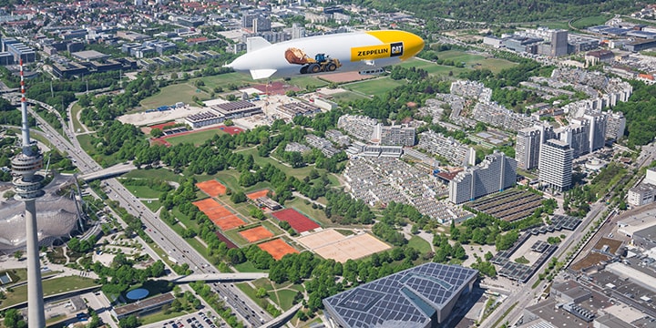 Olympiaturm München Zeppelin über dem Olympiaturm in München